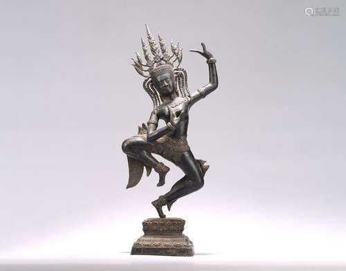 A COPPER ALLOY STANDING FIGURE OF APSARA