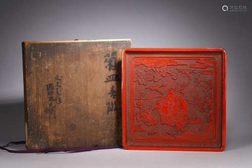 A CHINESE CINNABAR LACQUER 'BUDAI AND BOYS' SQUARE PLATE