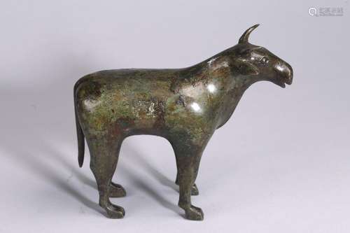 AN ARCHAIC BRONZE MODEL OF STANDING BUFFALO