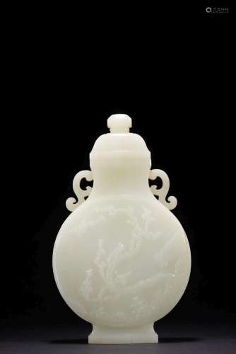 A WHITE JADE 'MAGPIE AND PLUM BLOSSOM' VASE