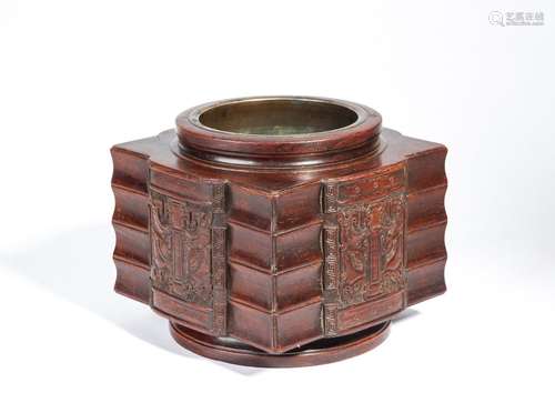 A HUANGHUALI CARVED 'TAOTIE' BRONZE INCENSE BURNER