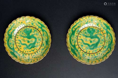 A PAIR OF GREEN ENAMEL YELLOW GROUND DISHES