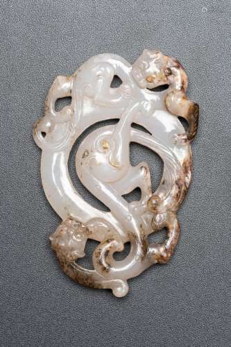A WHITE AND RUSSET JADE 'CHILONG' PENDANT