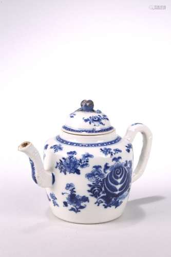 A BLUE AND WHITE TEAPOT AND COVER