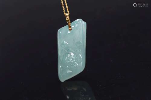 A NATURAL JADEITE 'LOTUS' PENDANT