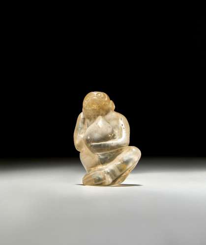 A BACTRIAN ROCK CRYSTAL FIGURINE OF A SEATED MONKEY, CIRCA 2...