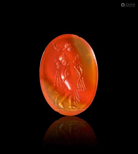 A ROMAN CARNELIAN INTAGLIO DEPICTING DEMETER CARRYING WHEAT,...