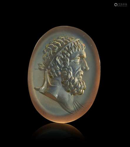 A ROMAN INTAGLIO WITH HEAD OF HERCULES CIRCA 2ND-3RD CENTURY...