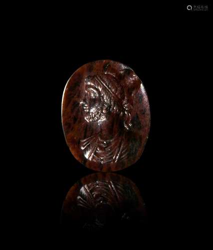 A ROMAN BLOODSTONE INTAGLIO OF A MAN DEPICTED AS SERAPIS, 2N...