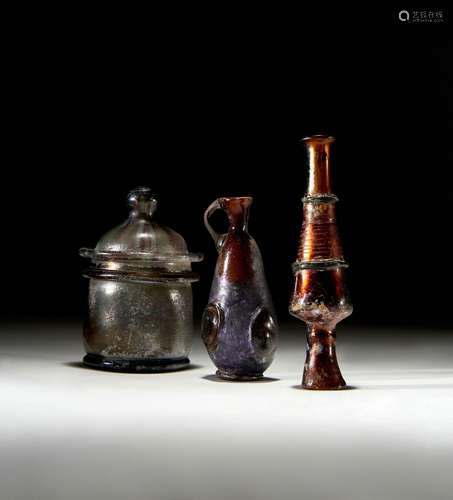 THREE ROMAN GLASS COSMETIC BOTTLES, 1ST CENTURY A.D.