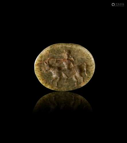 A GREEK JASPER SCARAB OF A MAN RIDING A BULL, ARCHAIC PERIOD...