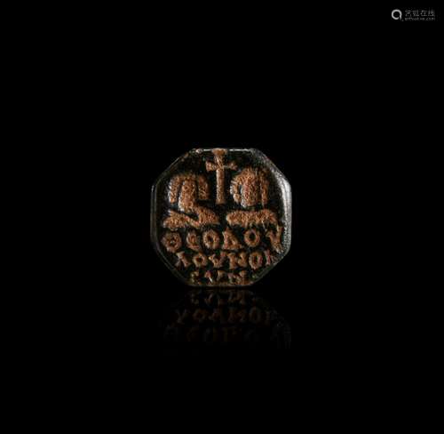 A BYZANTINE INTAGLIO WITH PORTAIRS OF A COUPLE AND A CROSS (...