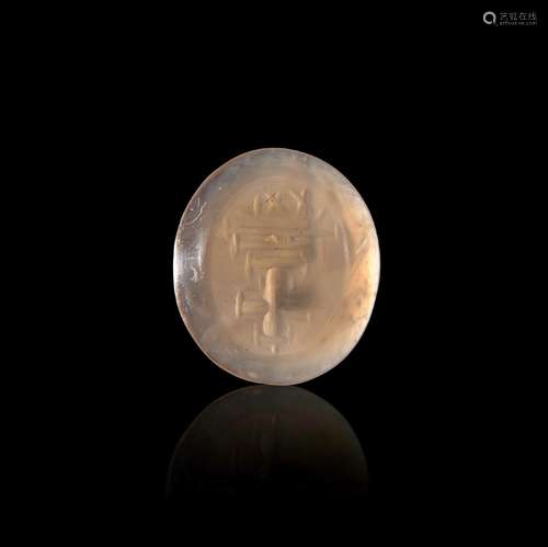 A BYZANTINE CHALCEDONY INTAGLIO WITH A CROSS & INSCRIPTI...