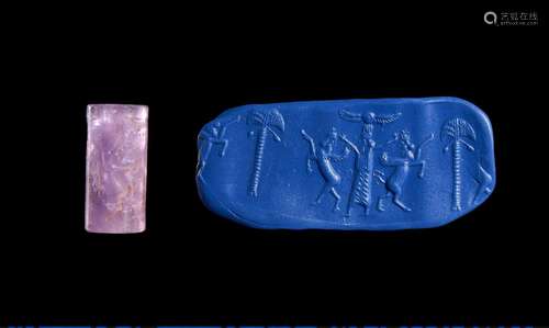 A BABYLONIAN AMETHYST CYLINDER SEAL CIRCA 1900-1700 B.C OR L...