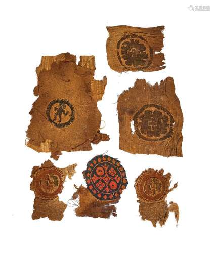 SIX COPTIC WOOL AND LINEN TEXTILE FRAGMENTS CIRCA 5TH-9TH CE...