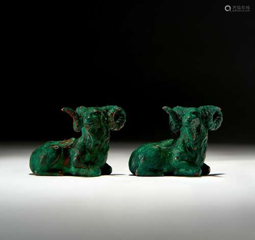 TWO LURISTAN BRONZE RECUMBENT BULLS, CIRCA 9TH-7TH CENTURY