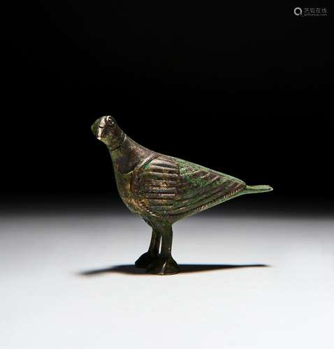 A SILVER INLAID SELJUK BRONZE BIRD PENDANT, PERSIA, 12TH CEN...