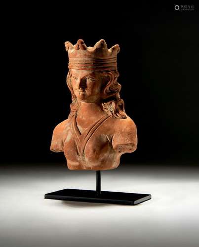 A GANDHARA TERRACOTTA BUST OF A CROWNED KING, CIRCA 5TH CENT...