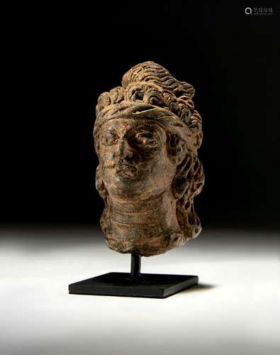 A GANDHARA GREY SCHIST BUST OF A NOBLE MAN, CIRCA 4TH-5TH CE...