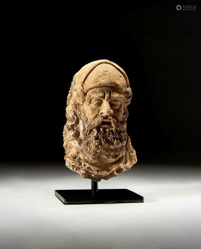 A GANDHARA STONE HEAD OF A BEARDED NOBLE MAN, CIRCA 5TH CENT...