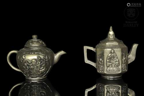 Two metal teapots, China, 20th century