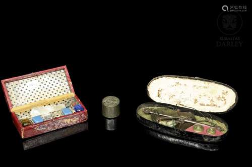 Antique utensils with box and a metal stamp, 19th century