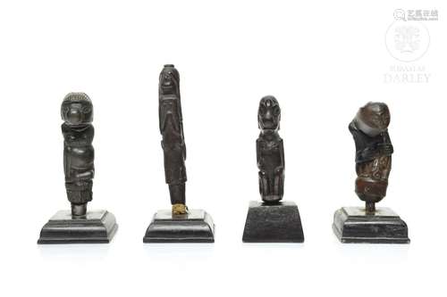 Four wooden Kris handles, Indonesia, 19th - 20th century