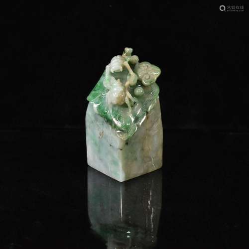 CHINESE JADITE SEAL WITH CARVING ON THE TOP