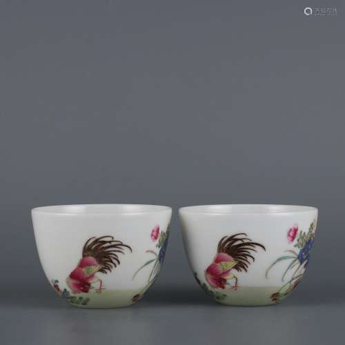 A pair of cups with pastel inscriptions and cockfighting pic...
