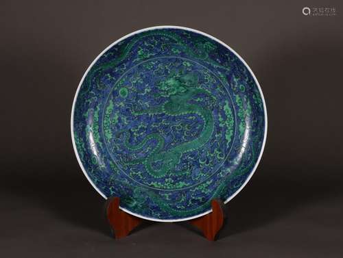 Seawater dragon pattern plate with green color on blue backg...