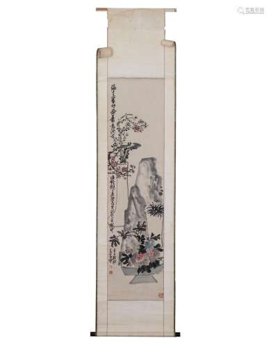 A CHINESE PAINTING OF FLOWERS AND STONE