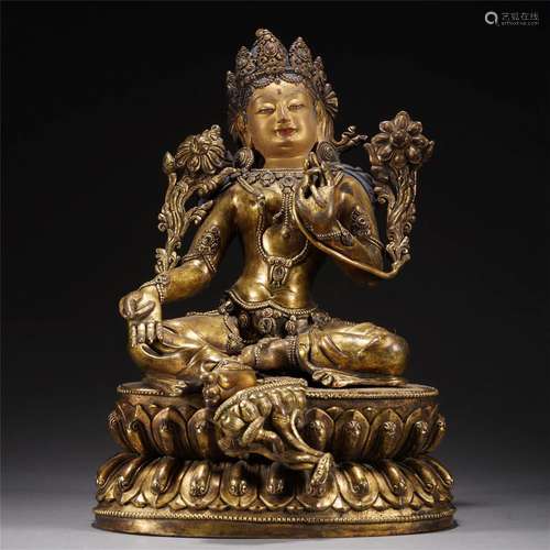 A TIBETAN BRONZE-GILT GREEN TARA