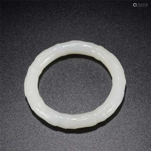 A CHINESE CARVED WHITE JADE BAMBOO BANGLE