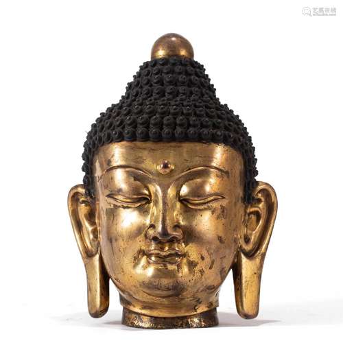 A CHINESE BRONZE-GILT BUDDHA HEAD