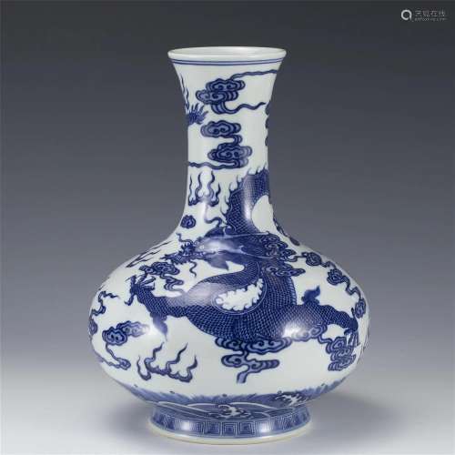 A CHINESE BLUE AND WHITE DRAGON BOTTLE VASE