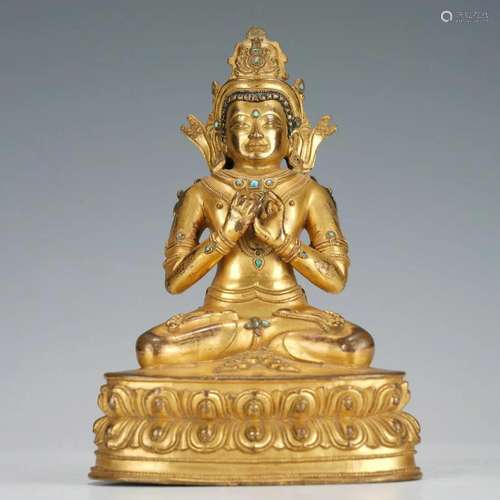 A SINO-TIBETAN BRONZE-GILT MAITREYA