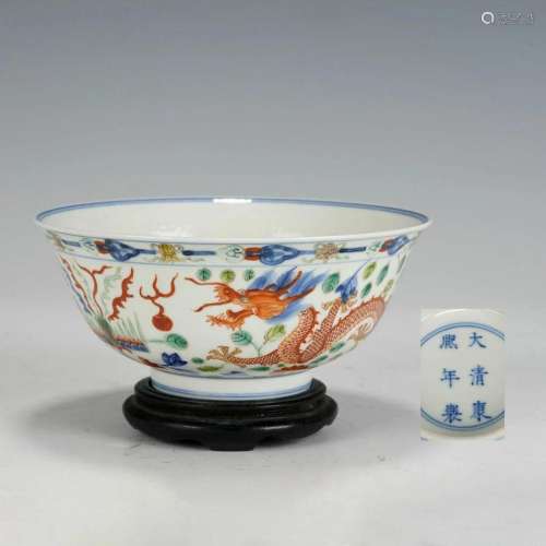 A CHINESE FAMILLE VERTE DRAGON AND PHOENIX BOWL