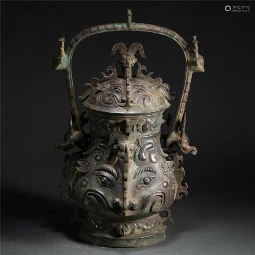 A CHINESE ARCHAIC BRONZE WINE VESSEL YOU