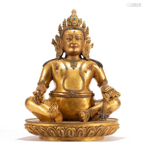 A TIBETAN BRONZE-GILT ADEPT