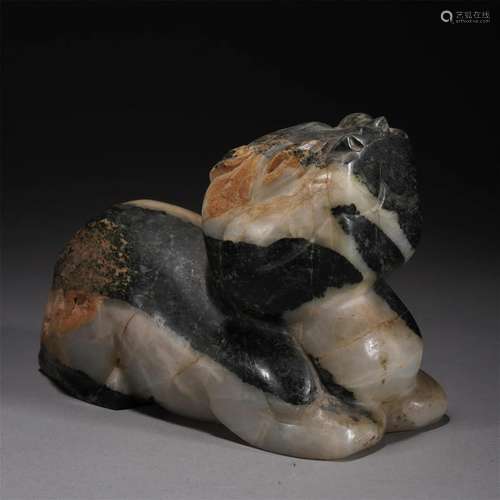 A CHINESE CARVED JADE MYTHICAL BEAST