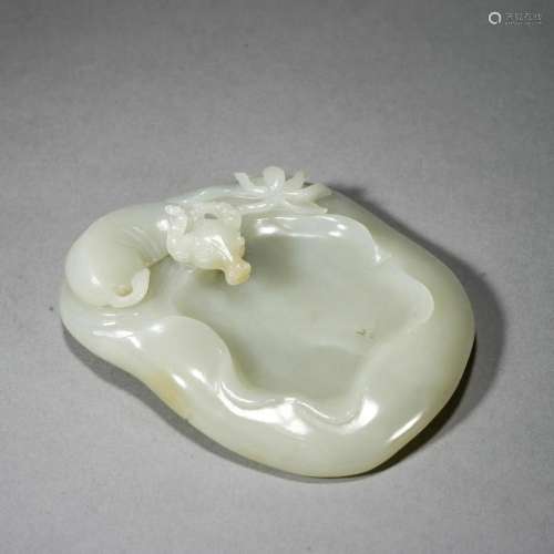 A CHINESE CARVED WHITE JADE BUFFALO INKWELL