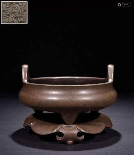 Three-legged incense burner with copper tires and cupped ear...