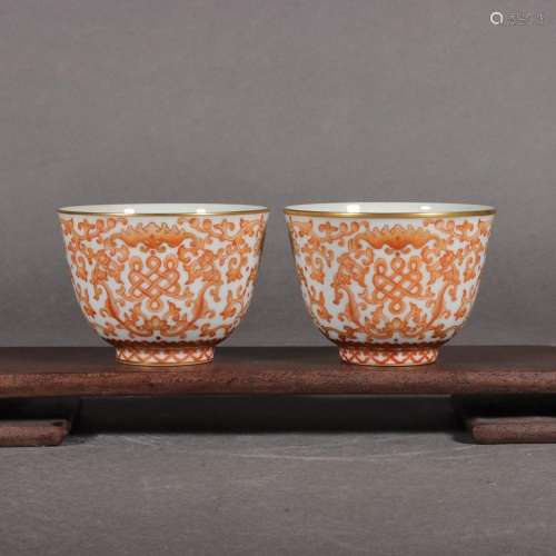 Pair of alum red and gold teacups