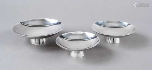 Three saké bowls, Japan, 20th century, silver hallmarked, on...