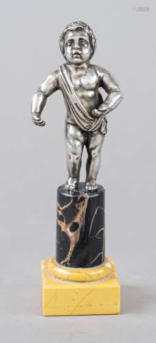 Standing putto, silver tested, on round pedestal with square...
