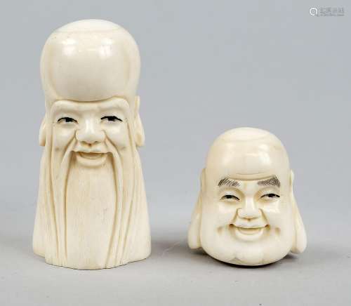 Two sly heads, China or Japan, 20th c., engraved bone carvin...