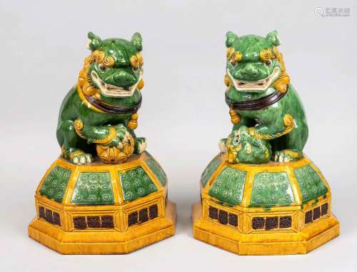 Pair of guardian lions, China, 20th c., glazed earthenware w...