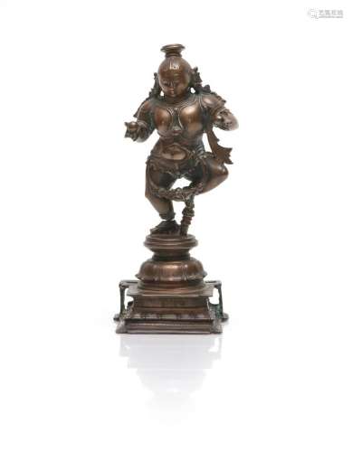 Rare statue de Krishna dansant en alliage de cuivre. En appu...