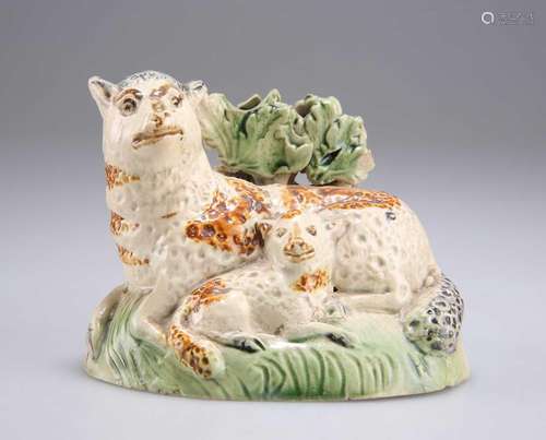 AN EARLY 19TH CENTURY YORKSHIRE POTTERY MODEL OF A EWE AND L...