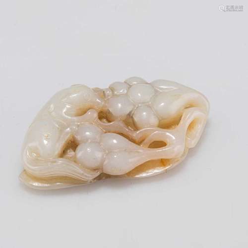 A CHINESE JADE GROUP OF A SQUIRREL AND GRAPEVINE
